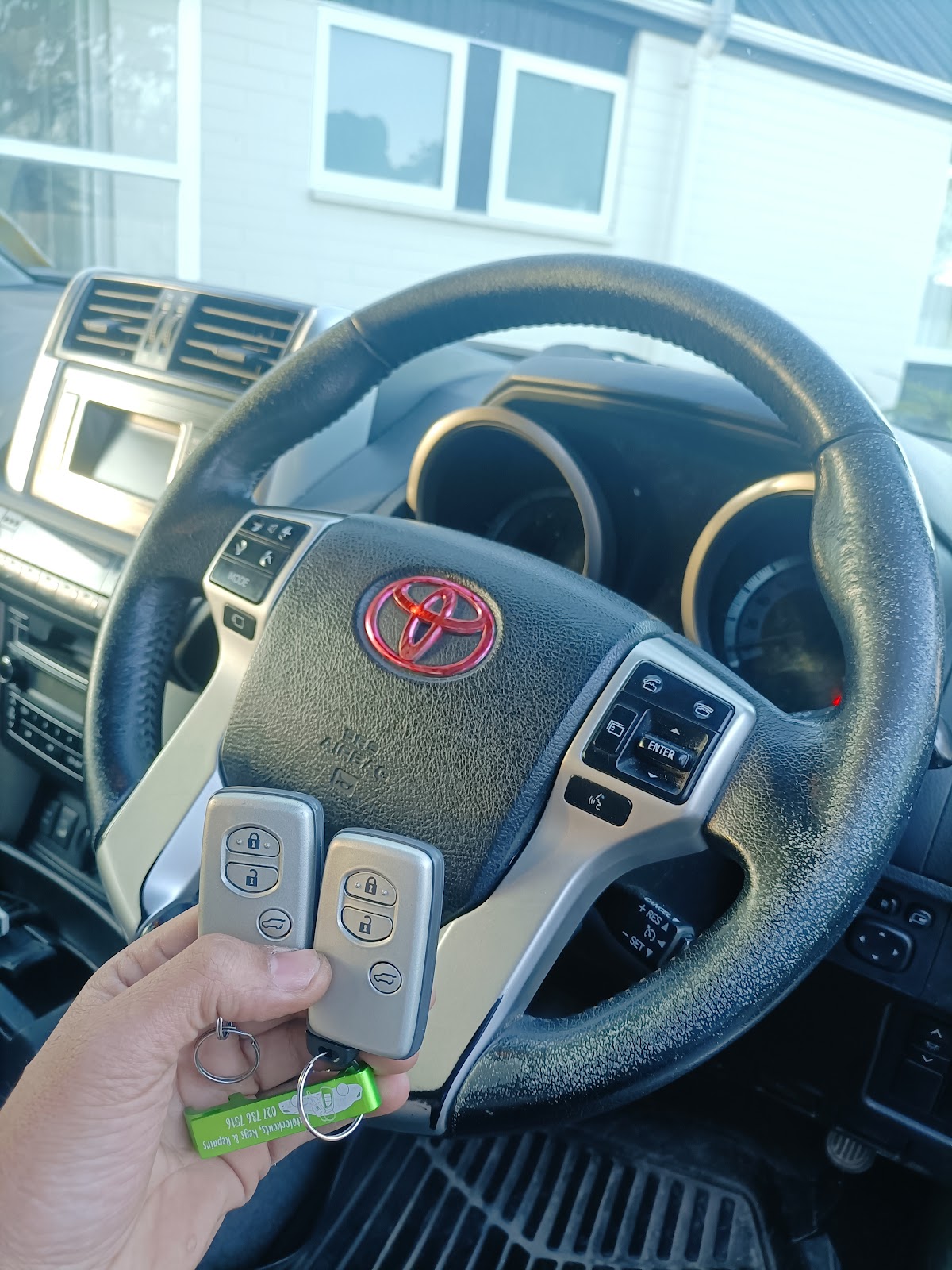 Two freshly programmed Toyota smart keys, ready to hand back