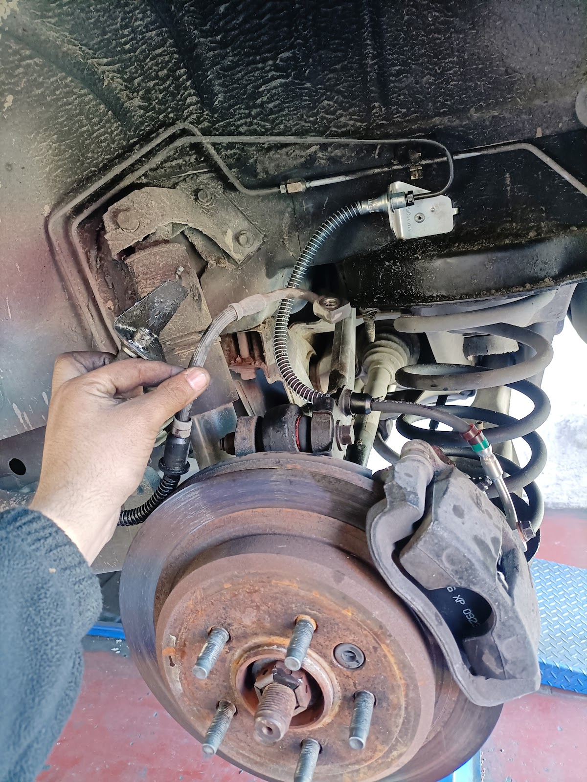 Brake and suspension repair work on the hoist